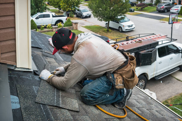Professional Roof Replacement technician working in Brookville, NY